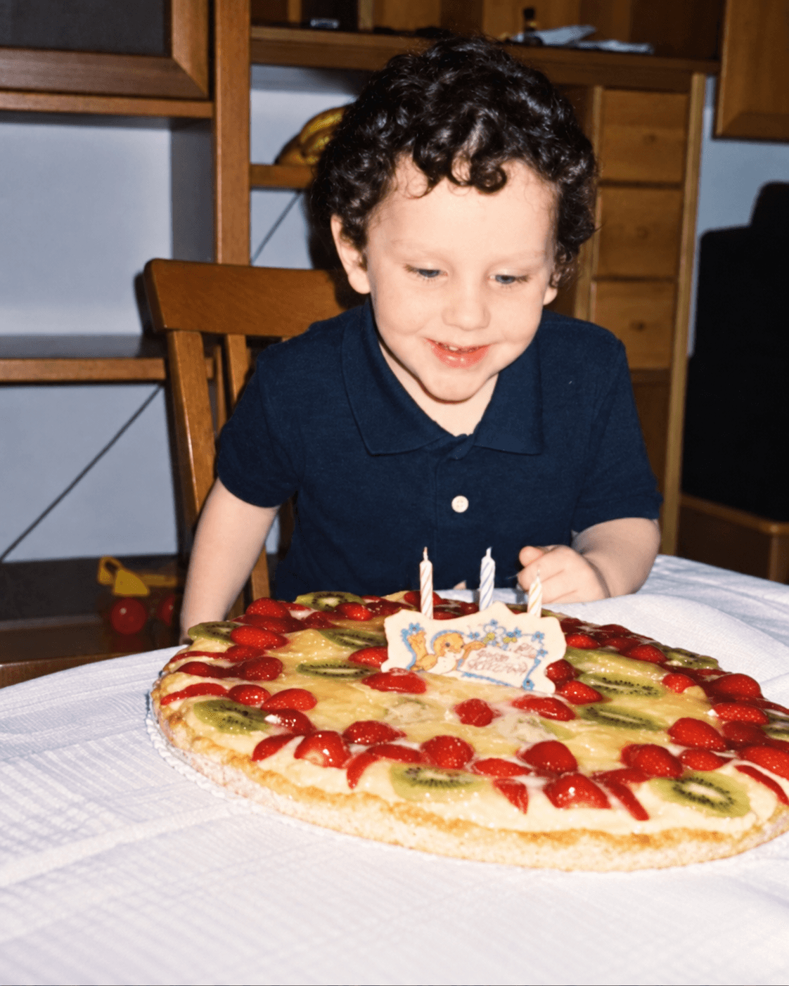 Matteo as a child with his birthday cake